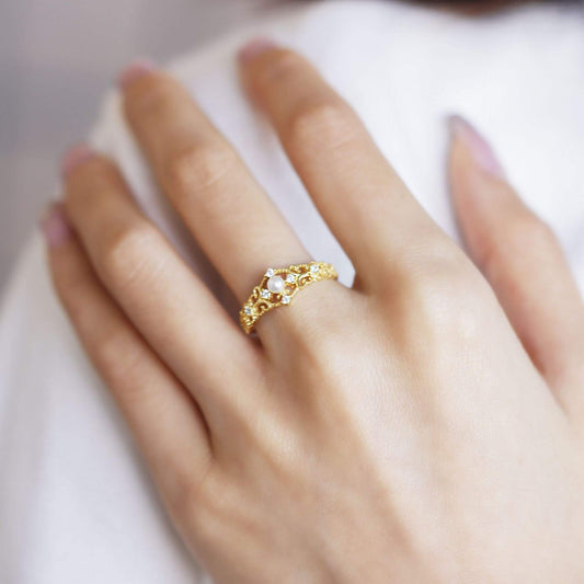 Woman's hand wearing a geometric silver adjustable Ferina Ring, showcasing elegant design and modern style.
